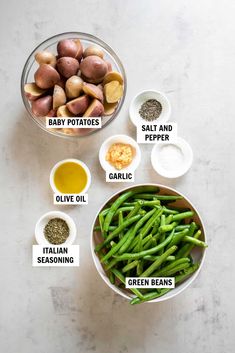 ingredients for green beans and potatoes in bowls on a white counter top with the words baby potatoes, salt and pepper