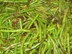 green beans are being cooked in a pan