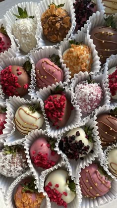 chocolate covered strawberries are arranged in the shape of a heart on a white platter