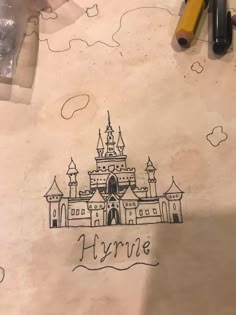a drawing of a castle is shown on paper