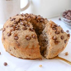 a chocolate chip donut with a bite taken out of it