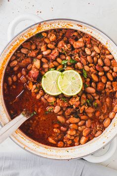 a large pot filled with beans and lime