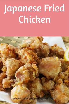japanese fried chicken on a white plate with lemon wedges next to it and text overlay