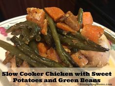 slow cooker chicken with sweet potatoes and green beans on a floral plate, text reads slow cooker chicken with sweet potatoes and green beans
