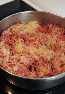 a pan filled with food sitting on top of a stove