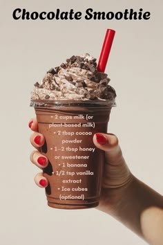a woman holding up a chocolate smoothie in her hand with information about the ingredients