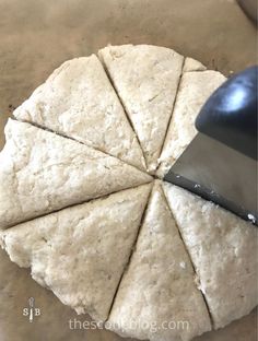 the dough is being cut into pieces with a knife