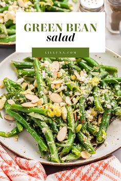 green bean salad on a plate with almonds and parmesan cheese in the background