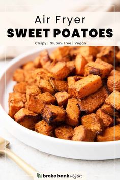 air fryer sweet potatoes in a white bowl with chopsticks on the side