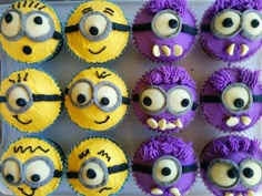 cupcakes with yellow and purple frosting decorated as minion faces on a tray