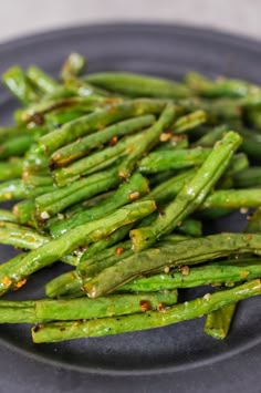 asparagus on a plate with seasoning sprinkles in the middle