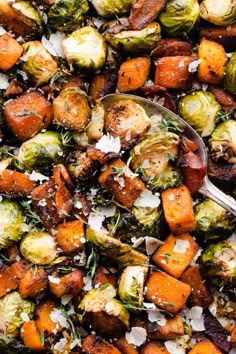 roasted brussel sprouts and carrots with parmesan cheese on top