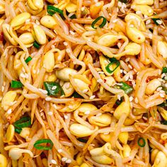 noodles and vegetables are mixed together in a dish