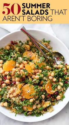 a white bowl filled with salad topped with oranges and chickpeas next to a spoon