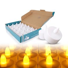 several candles in a box with the lid open next to it and an empty candle holder