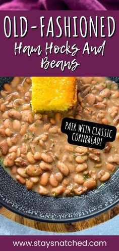 a bowl filled with baked beans and topped with a piece of cornbread on the side