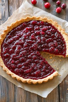 there is a pie with cranberry sauce on it