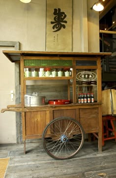 an old fashioned cart with wheels in a room