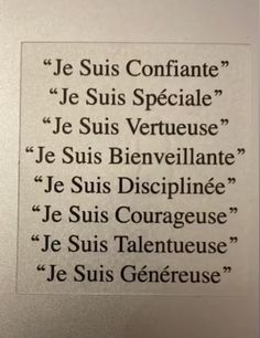 a sign that is on the wall in front of a door with words written below it