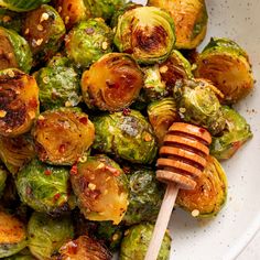 roasted brussel sprouts with honey in a white bowl