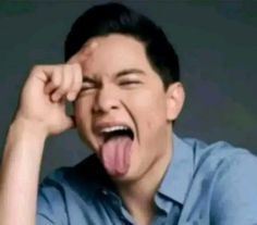 a man making a funny face with his tongue out