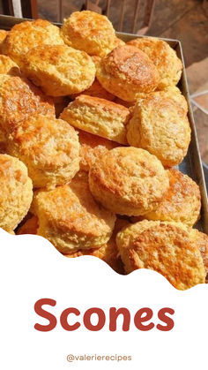 there is a box full of scones with the words scones in red on it