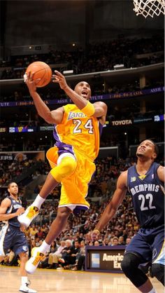 a basketball player jumping up to dunk the ball