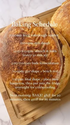 two round breads sitting on top of a cutting board