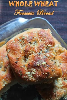 two pieces of bread sitting on top of a pan with the words whole wheat fetaula bread