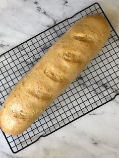 a loaf of bread sitting on top of a cooling rack