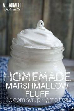 homemade marshmallow fluff in a jar on a blue and white checkered cloth
