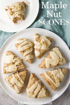 a white plate topped with scones covered in frosting