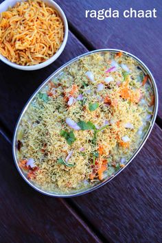two bowls filled with food sitting on top of a wooden table next to each other
