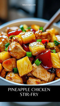 pineapple chicken stir fry in a bowl with chopsticks