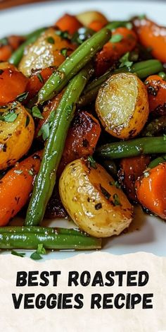 a white plate topped with green beans and carrots next to a pile of potatoes
