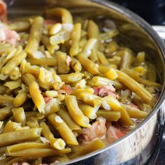 a pan filled with green beans and ham