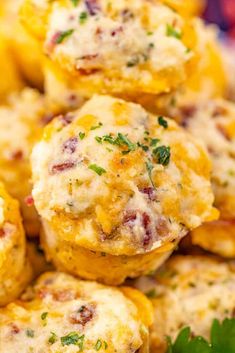 a close up view of some muffins with cheese and herbs