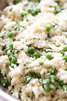 rice and peas are mixed together in a bowl