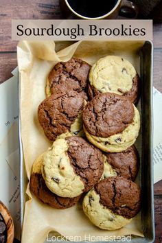 chocolate chip cookies in a cookie tin with the words sourdough brookies on it