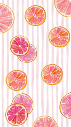 slices of grapefruit on striped pink and white paper with gold foiling,