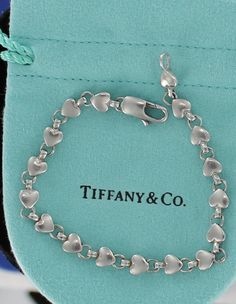 A personal favorite from my Etsy shop https://www.etsy.com/listing/245170262/rare-retired-tiffany-co-sterling-silver Tiffany & Co. Silver-gilt, Tiffany & Co. Necklace Collection, Tiffany And Co Heart Bracelet, Rare Tiffany & Co Silver, Tiffany & Co. Sterling, Silver Tiffany Bracelet, Tiffany Bracelet Silver Heart, Fake Tiffany Bracelet, Tiffany And Co Multi Heart Bracelet