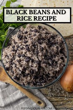 black beans and rice in a glass bowl next to garlic, parsley and an onion