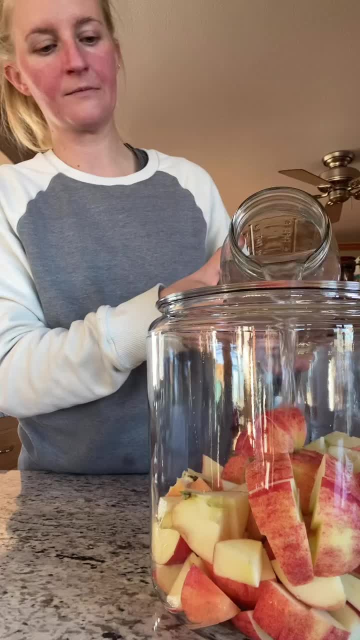 The deets 👇🏻 FRUIT VINEGAR Apples are most common but you can do it with other fruits, I have pear vinegar going right now too! Fill glass jar halfway with fruit scraps - cores, peels, etc. Cover with water, pay attention to how many cups of water you’re adding For every 1 cup water, add 1 tablespoon sugar & stir to combine, cover with paper towel or loosely with lid Stir morning and night for 2 weeks. Then strain and pour liquid back into jar. Put lid loosely back on and store in coo...