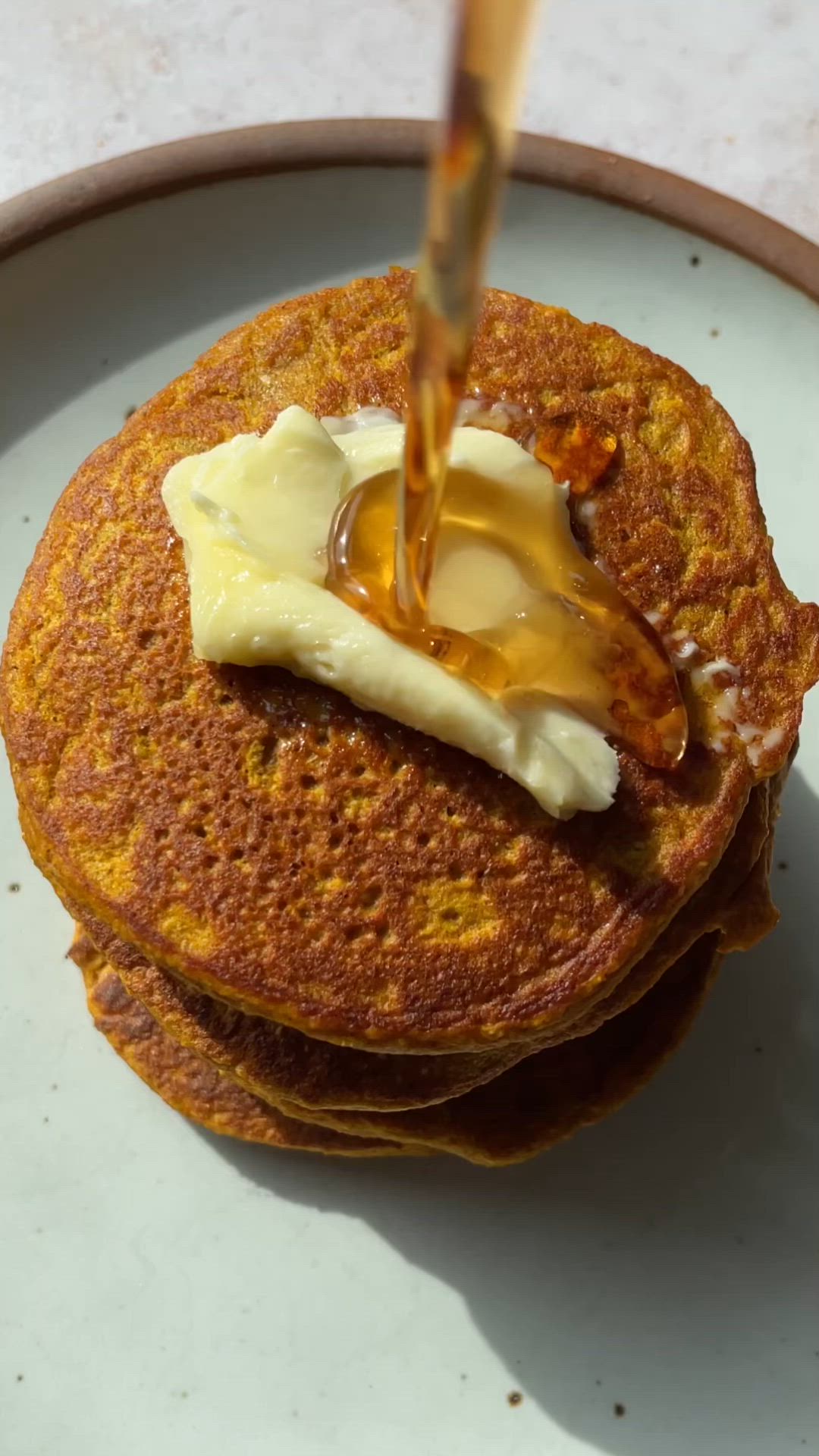 This contains: video making healthy pumpkin pancakes
