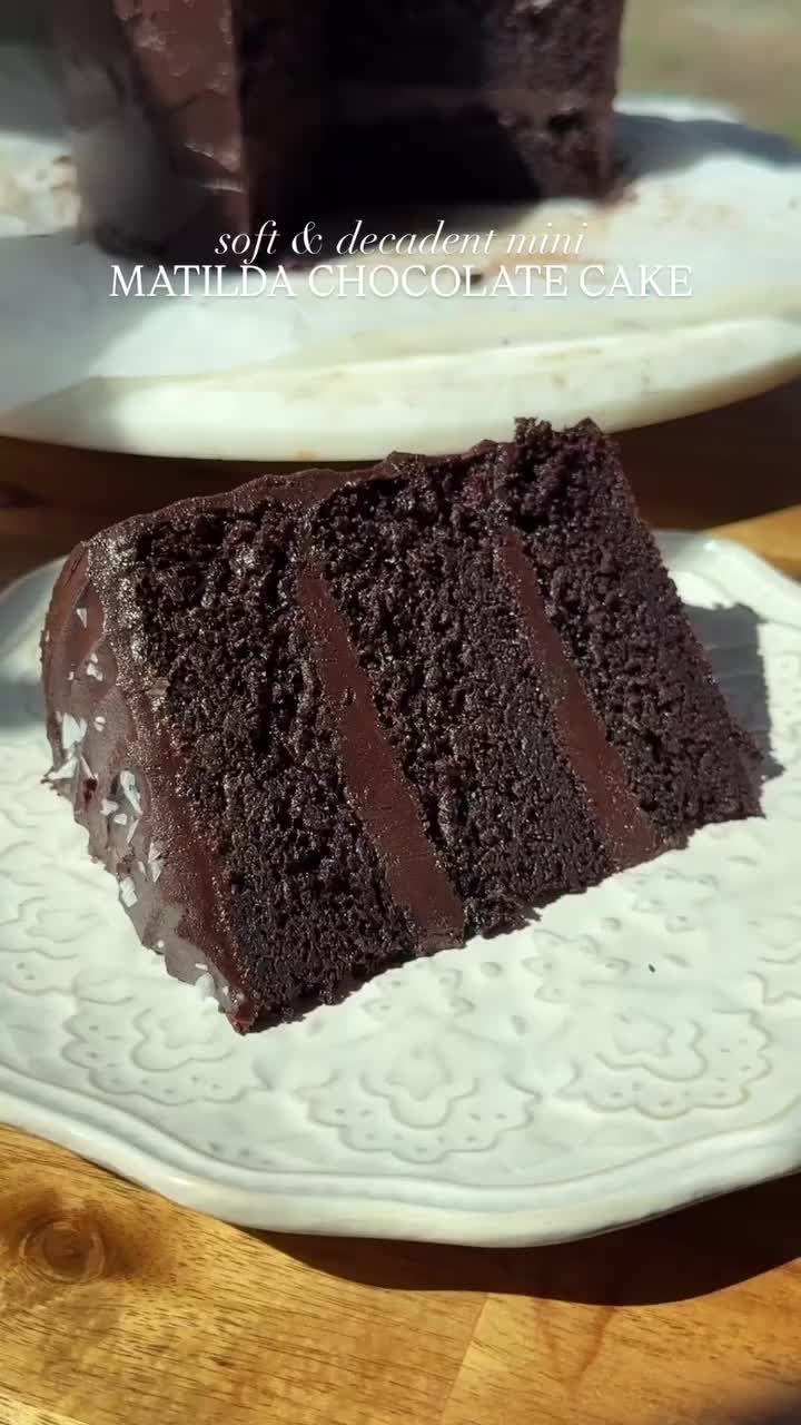 MINI MATILDA CHOCOLATE CAKE  Pure decadence ✨ Recipe below OR comment ‘CAKE’ to get the recipe sent to you 🤎  #Recipe Details: Chocolate Cake: - 1 3/4 cups (230g) AP flour - 1 3/4 cups (350g) granulated sugar - 3/4 cup (72g) cocoa powder - 2 tsp (12g) baking soda - 1 tsp (4g) baking powder - 1 tsp (6g) salt - 1 cup (240ml) buttermilk, room temp - 1/2 cup (120ml) avocado oil  - 2 eggs, room temp - 2 tsp (8g) vanilla  - 1 cup (240ml) hot brewed coffee  Choc Fudge Frosting: - 1 cup (226g) salted...