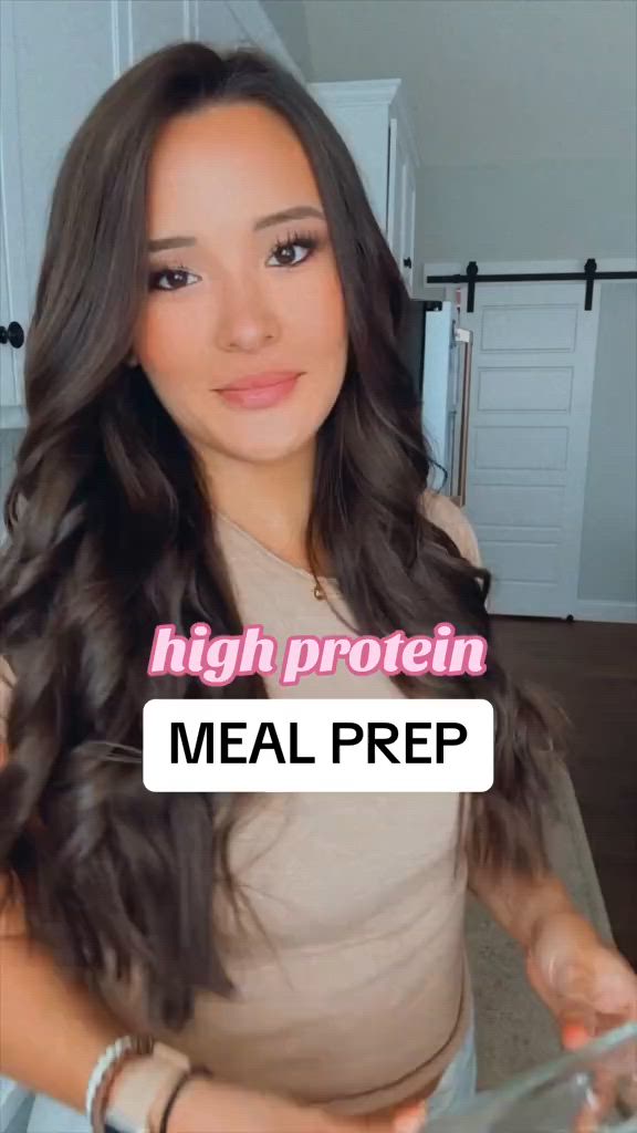 This may contain: someone is holding their food in front of the camera and pointing to it with both hands