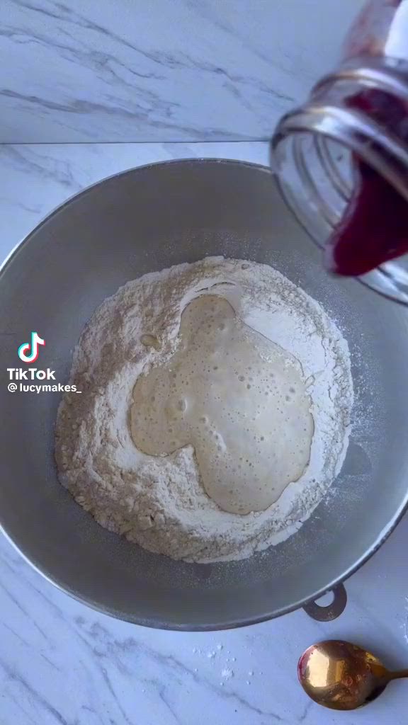 This contains an image of: Blueberry sourdough bagels with lemon poppy cream cheese