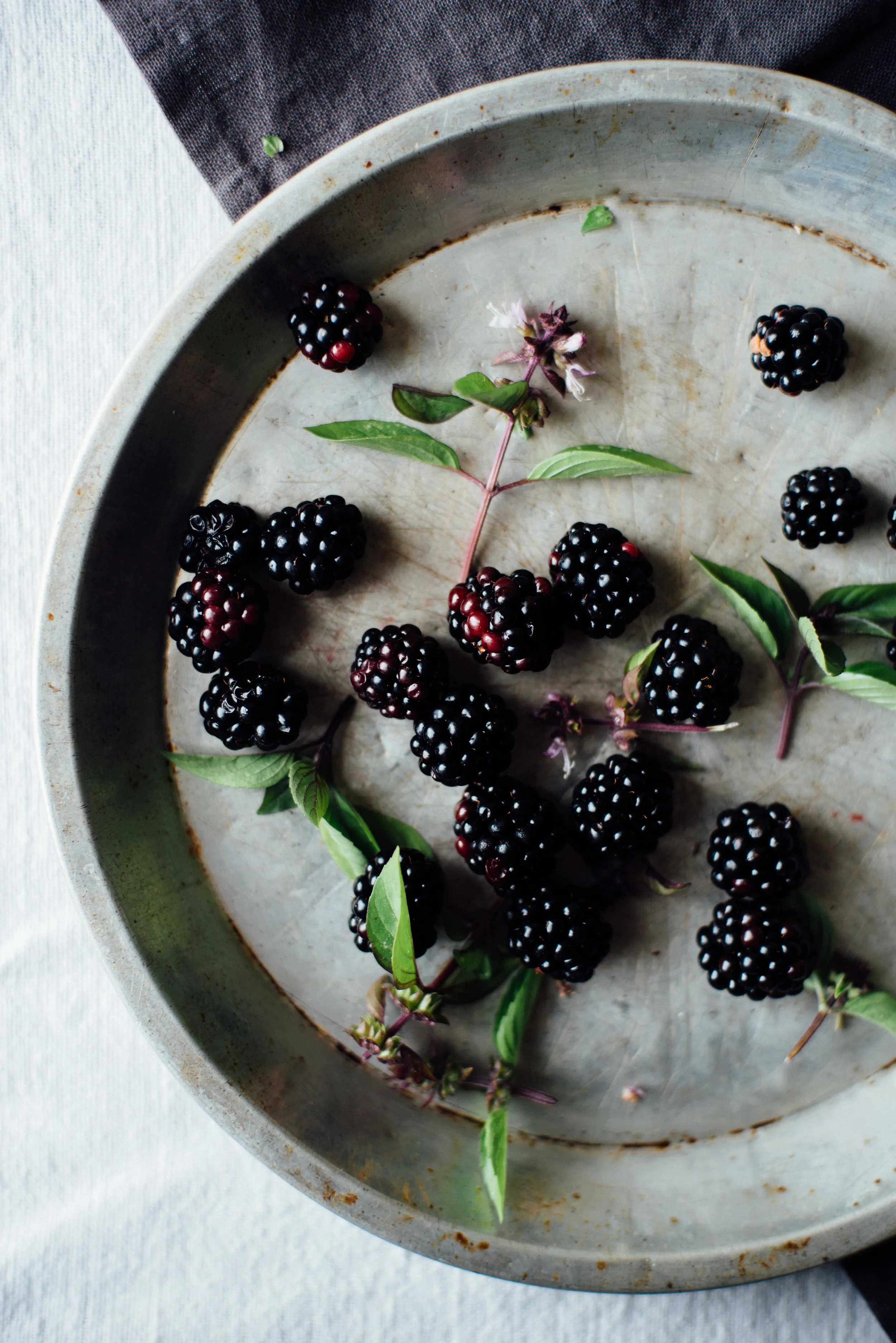 breakfast quinoa flakes w/ stewed blackberries + basil flowers | dolly and oatmeal