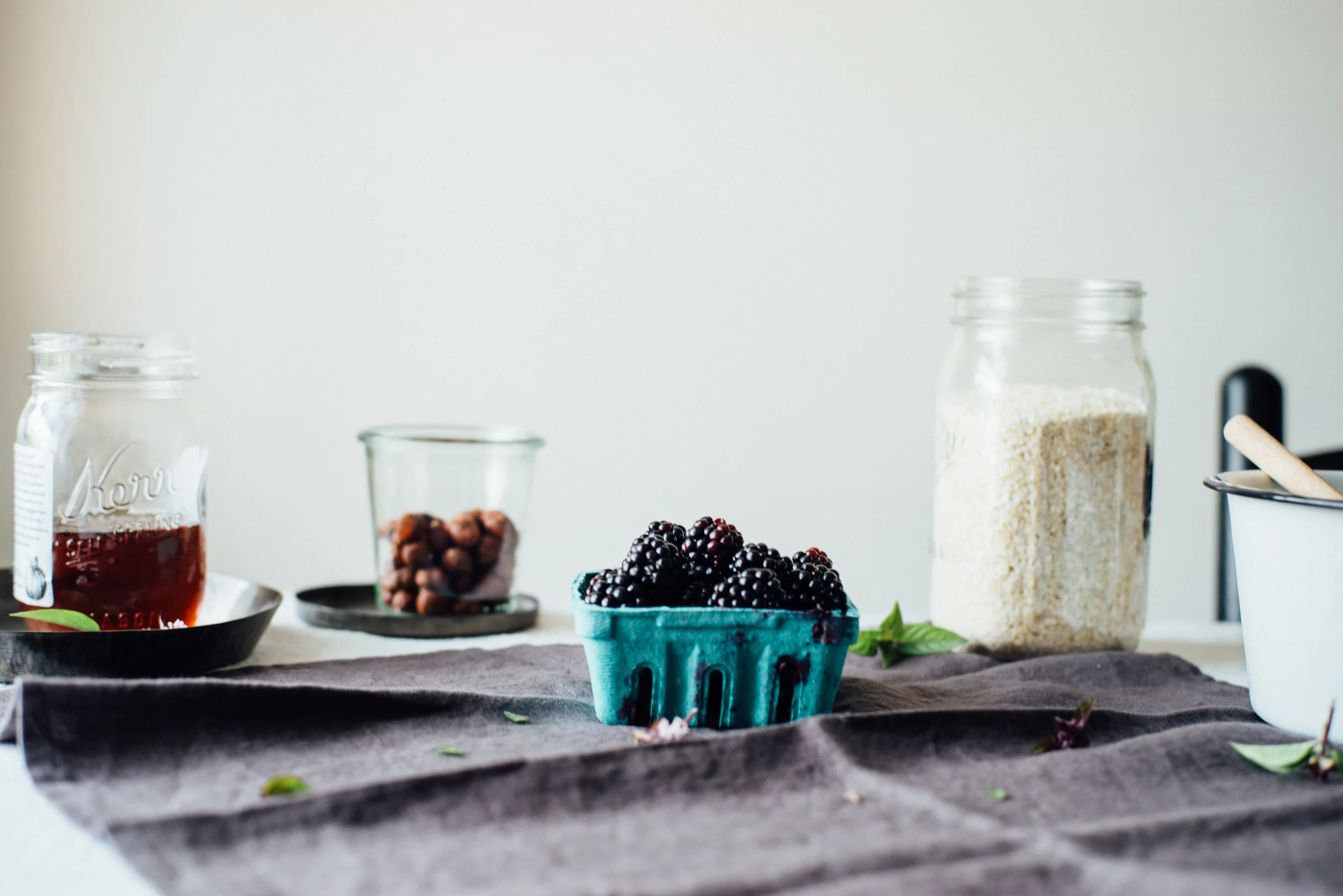 breakfast quinoa flakes w/ stewed blackberries + basil flowers | dolly and oatmeal