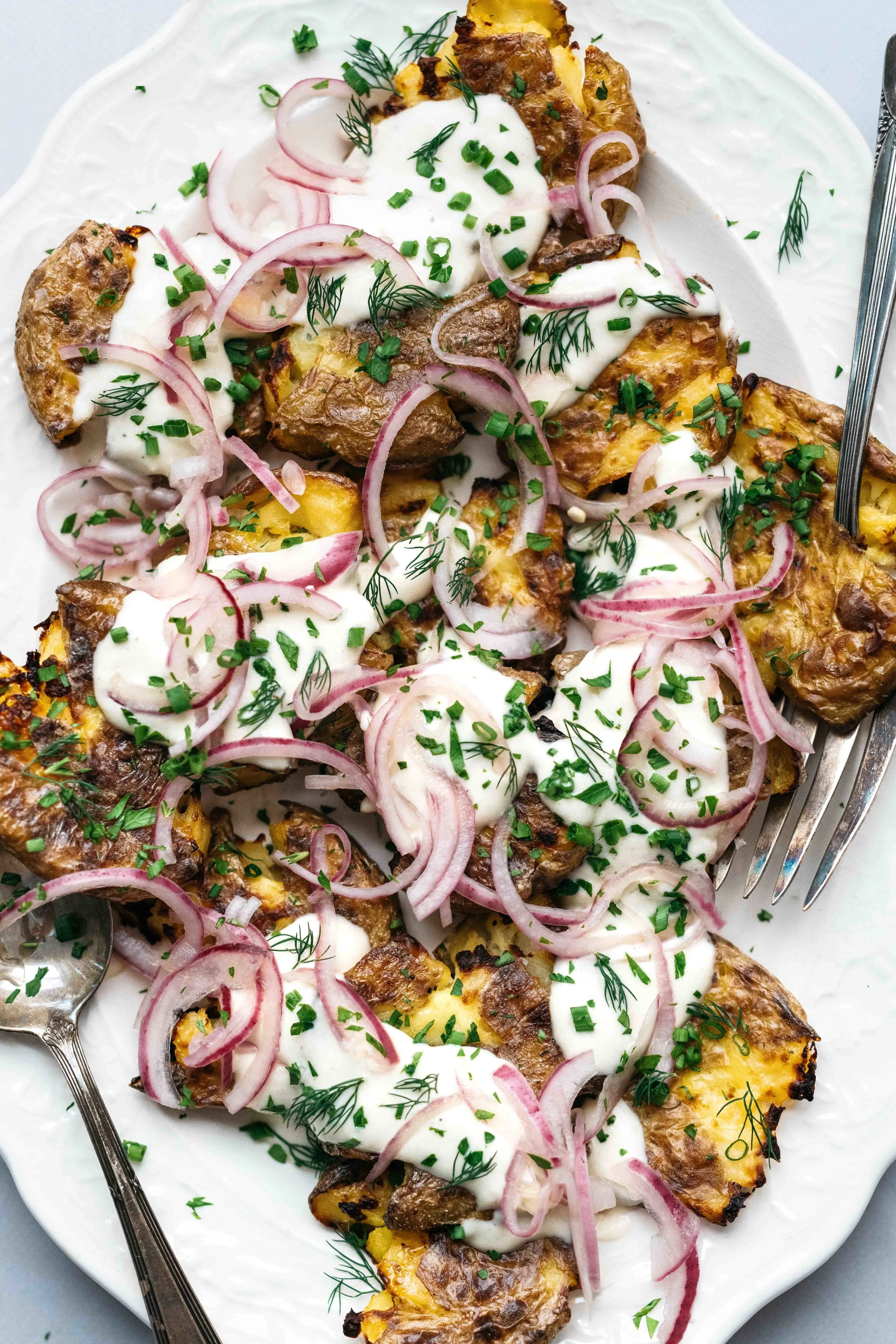 CRISPY SMASHED POTATO SALAD W/ GARLICKY YOGURT VINAIGRETTE & PICKLED RED ONIONS | dolly and oatmeal